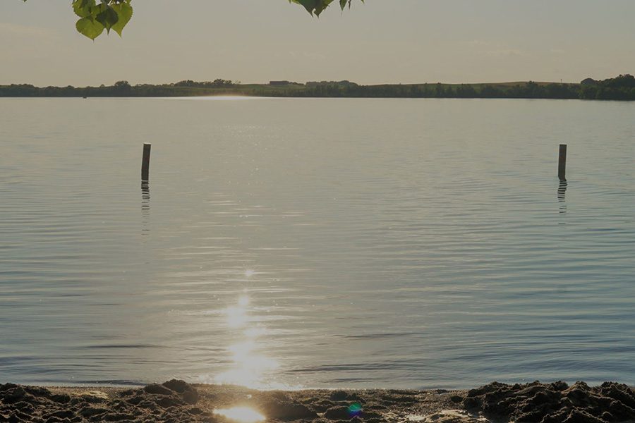 Health Insurance - Lake in a South Dakota Town on a Sunny Day with Sun Reflecting off the Water