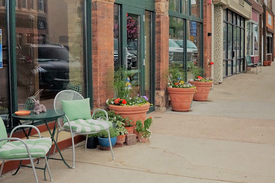 Personal Insurance - A Main Street in a Town in South Dakota and Close Up to a Store with Flowers and Chairs Outside